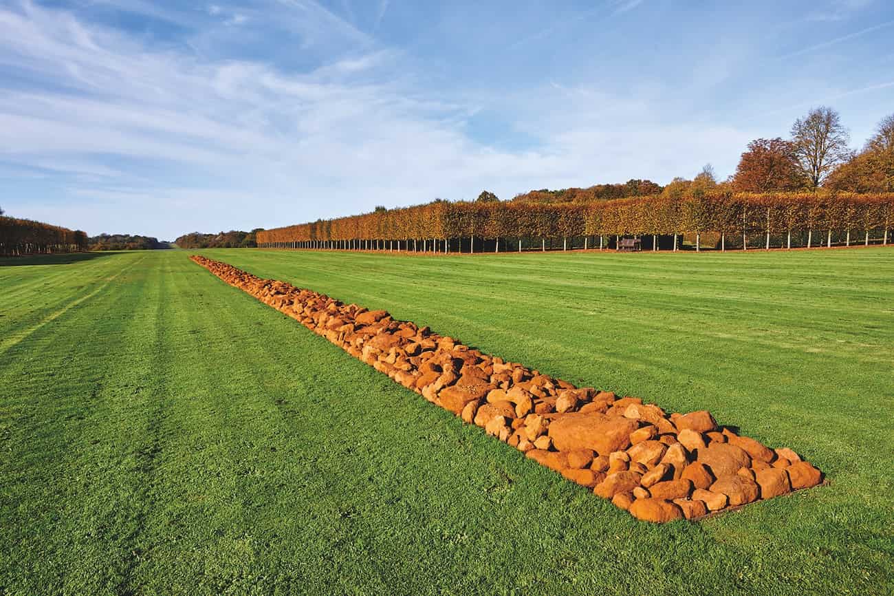 Richard Long, “A Line in Norfolk”, 2016, 84-metre Carr Stone Line on west axisof the house. Photo: Pete Hugg