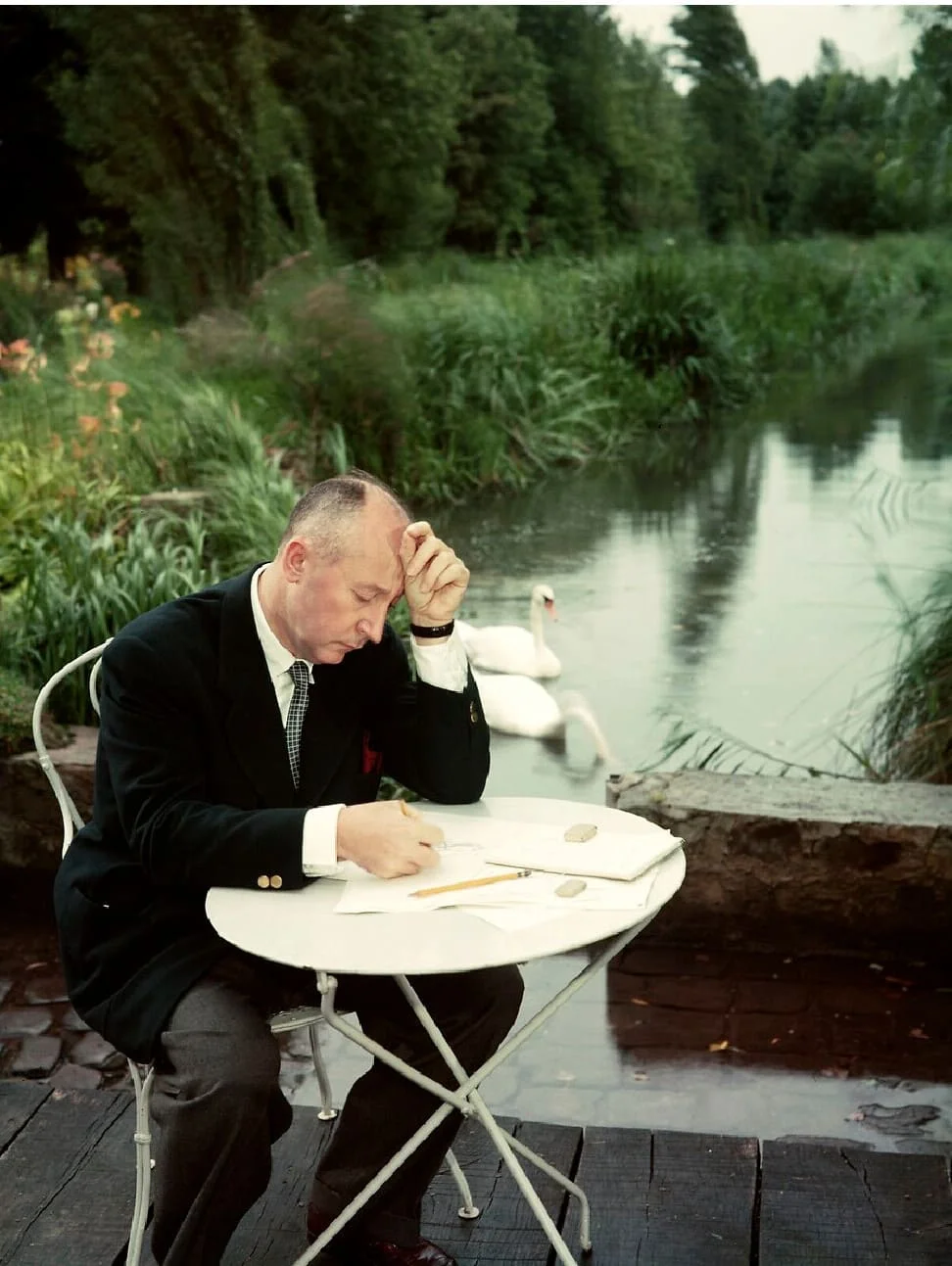 Christian Dior drawing in his garden at Milly-la-Forêt, circa 1954. Photograph by Eugene Kammerman/Gamma Rapho.