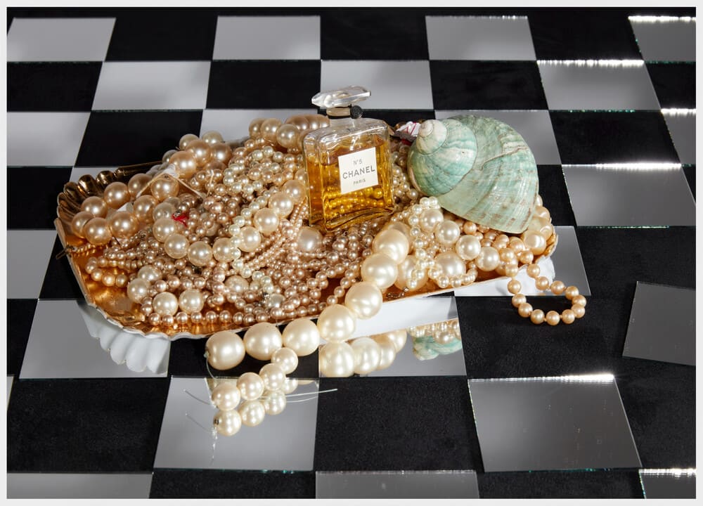 Roe Ethridge, Chanel No 5 from 1924 on Tray of Pearls and Mirror Checkerboard, 2025, UV-cured pigment print 50 x 70 inches (127 x 177.8 cm) Edition of 5 + 2 AP © Roe Ethridge Courtesy the artist and Gagosian