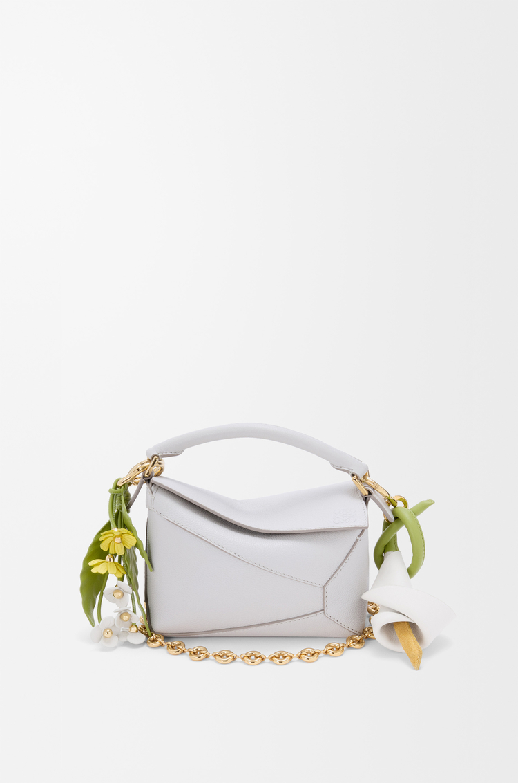 Strawberry flower charm in classic calfskin, 450€, Loewe.