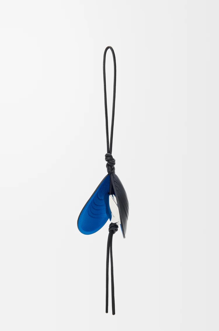 Shell charm in leather, 480€, Loewe.