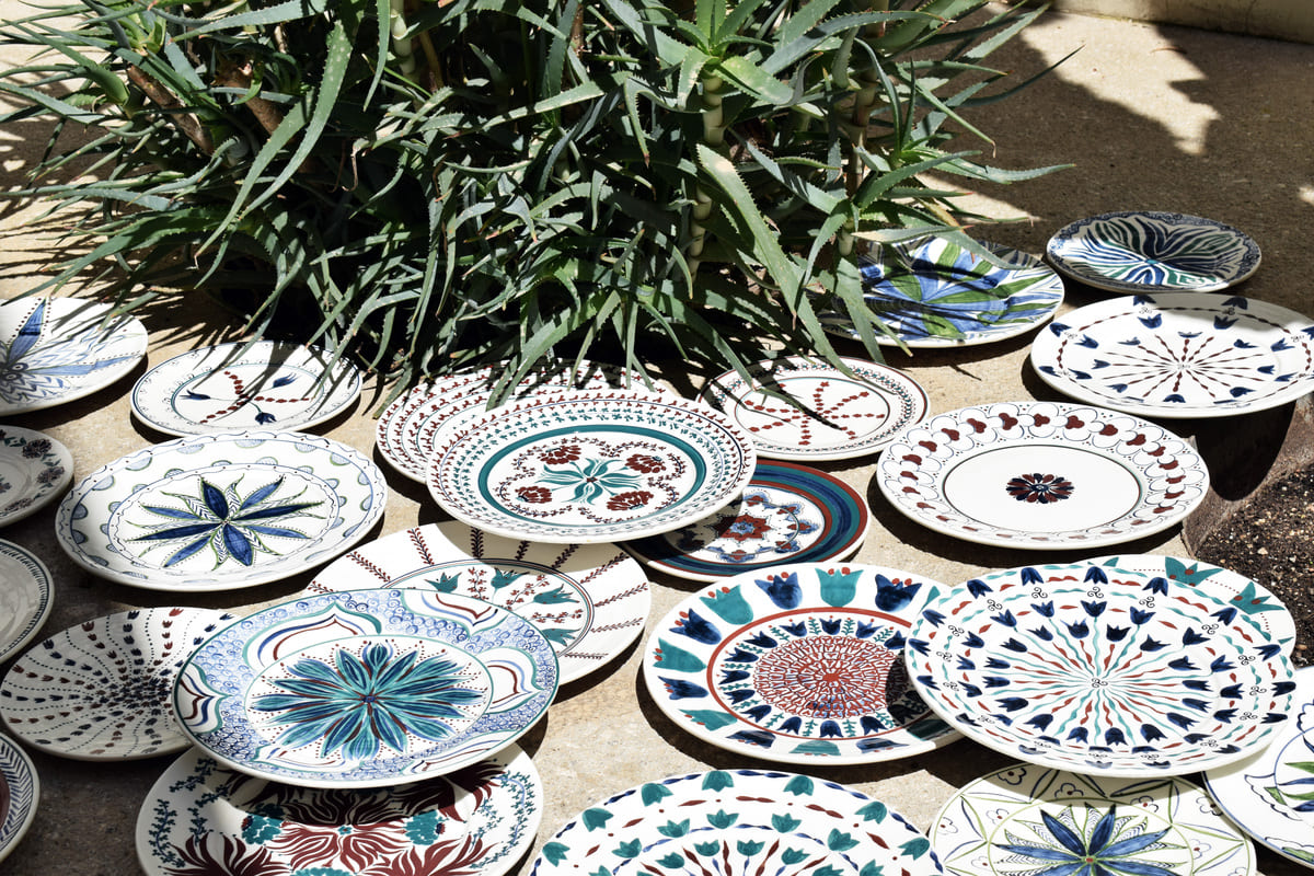 Atalanti Martinou, Quatrefoil, 2026, hand painted and glazed earthware clay, installation of 40 pieces of various dimensions