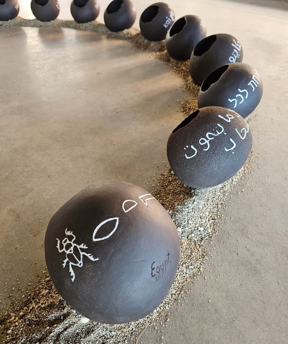 Mirsini Roumelioti, The Vessels of the First Light, 2025, Stoneware dark clay and porcelain, 33 x 250 x 250 cm. Photo by Vasileios Korakakis. 