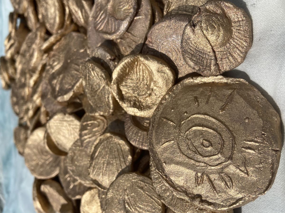 Lucille Uhlrich, Helios in reflection, 2026, Ceramics Coins dimensions variable.